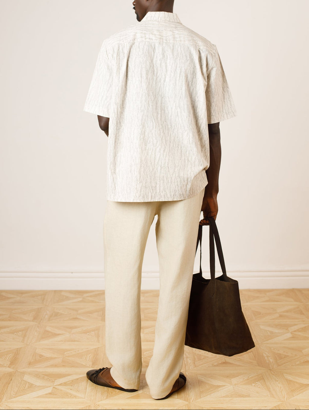 Sana Tapered Fit Trousers In Cream